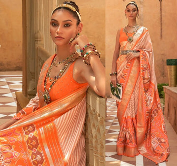 Orange   Patola Saree for Women With Contrast Patola Embellished Border And Very Soft Flowy Lightweight Silk