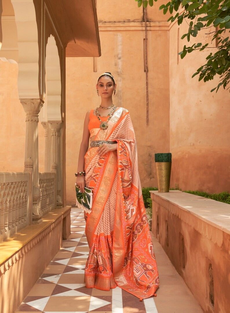 Orange   Patola Saree for Women With Contrast Patola Embellished Border And Very Soft Flowy Lightweight Silk